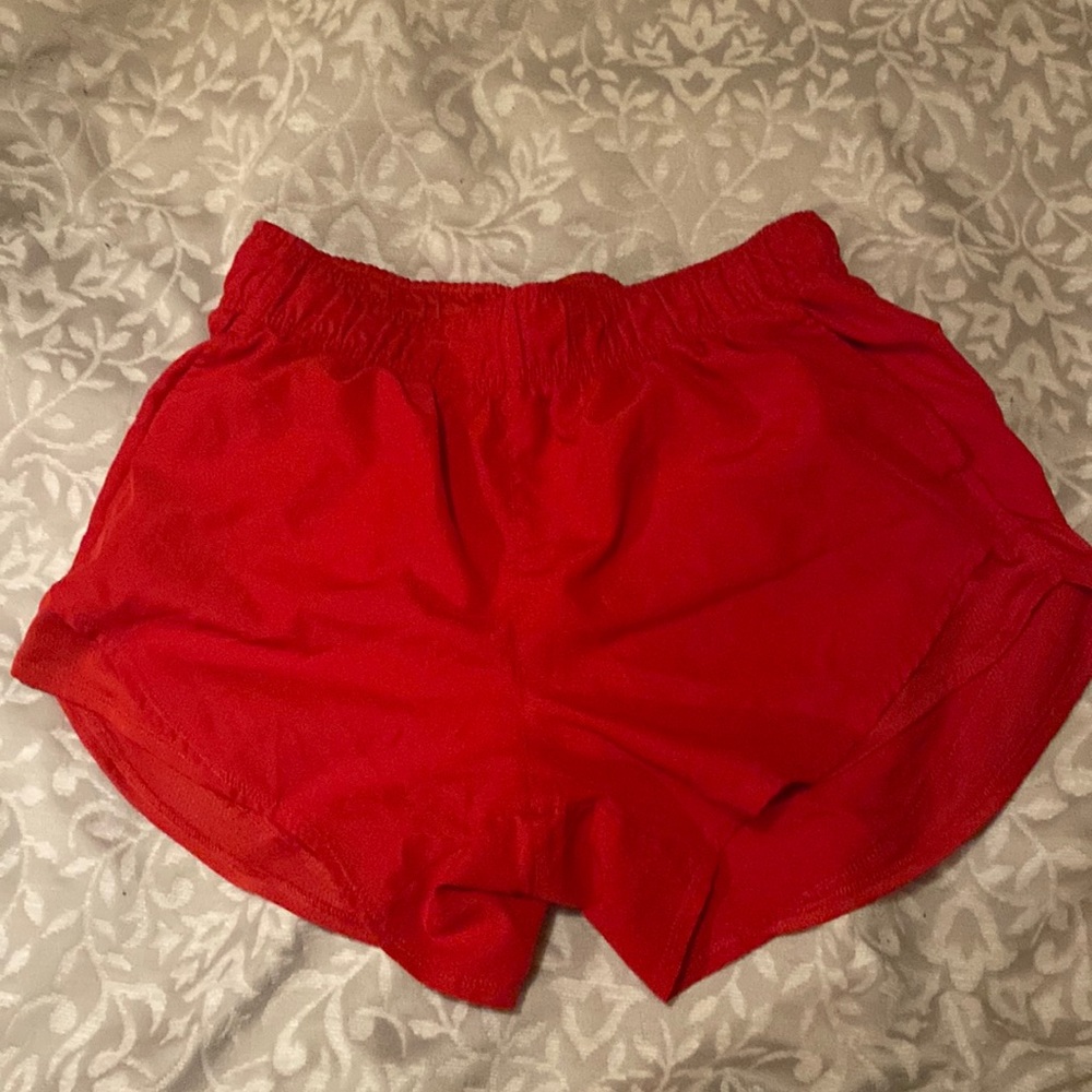 Red athletic shorts. Size S